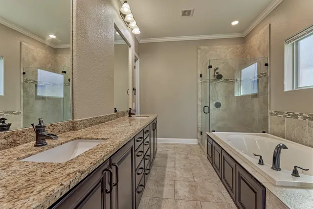 a bathroom with a granite countertop sink mirror and double