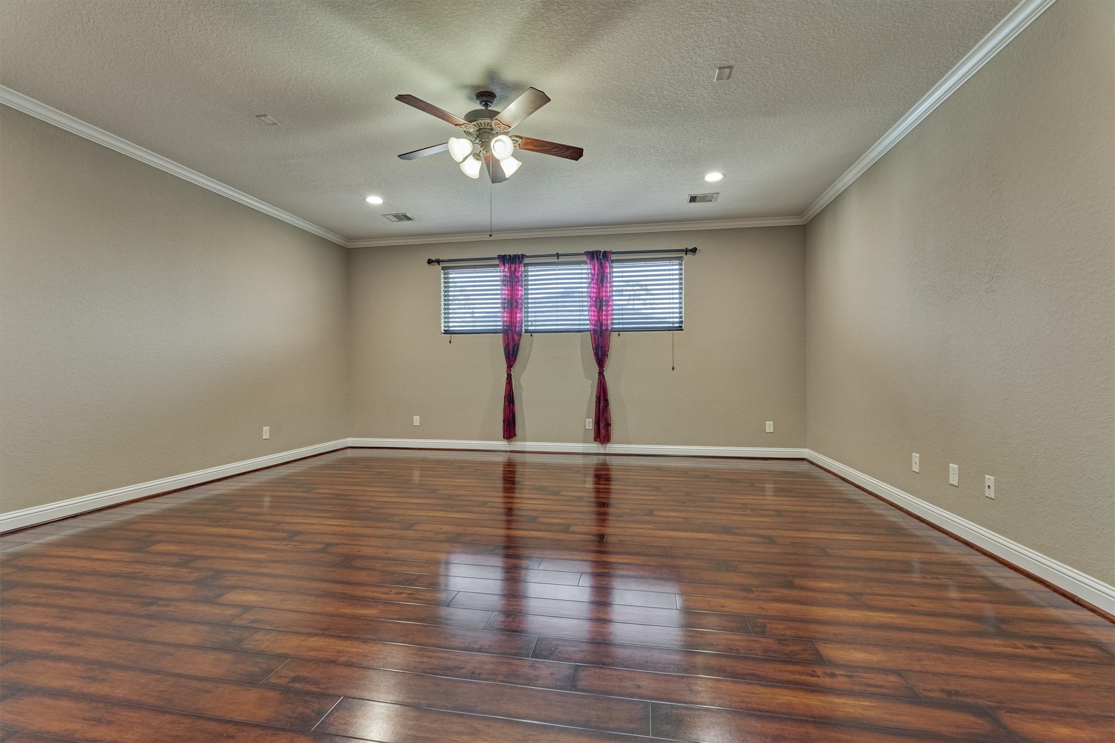 106 Bella Luce Shenandoah, TX 77381 - Photo 37 of 47 a view of an empty room with wooden floor and a window