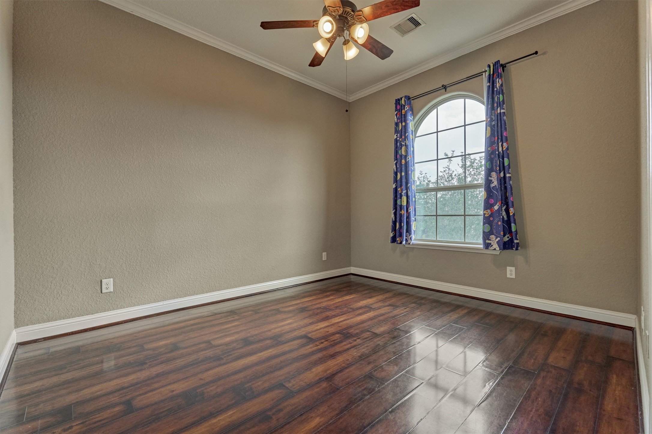 106 Bella Luce Shenandoah, TX 77381 - Photo 42 of 47 a view of an empty room with wooden floor and a window
