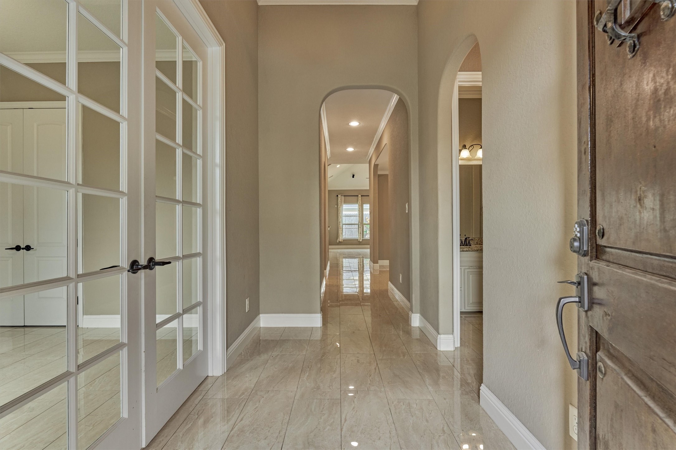 106 Bella Luce Shenandoah, TX 77381 - Photo 5 of 47 a view of a hallway with wooden floor and staircase