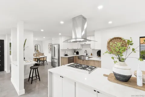 a kitchen with a stove and cabinets