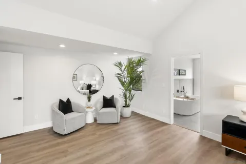 a living room with a couch and a ceiling fan