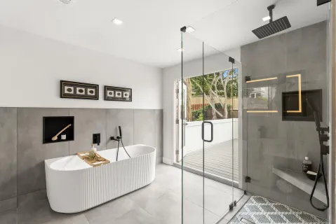 a white bath tub sitting in a bathroom