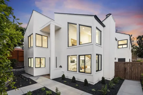 a front view of a house with outdoor space