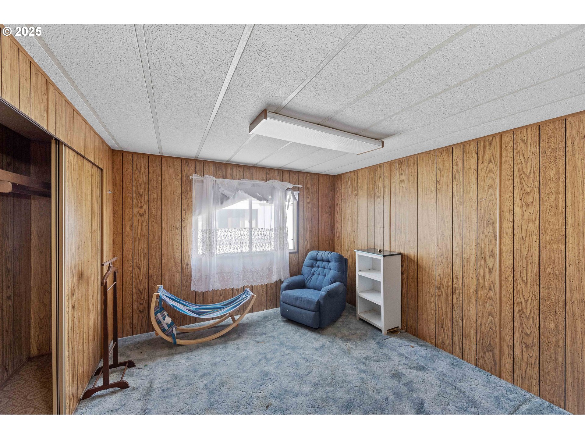 1413 Hawthorne Avenue, Unit 31 Reedsport, OR 97467 - Photo 12 of 16 a room with furniture and a window