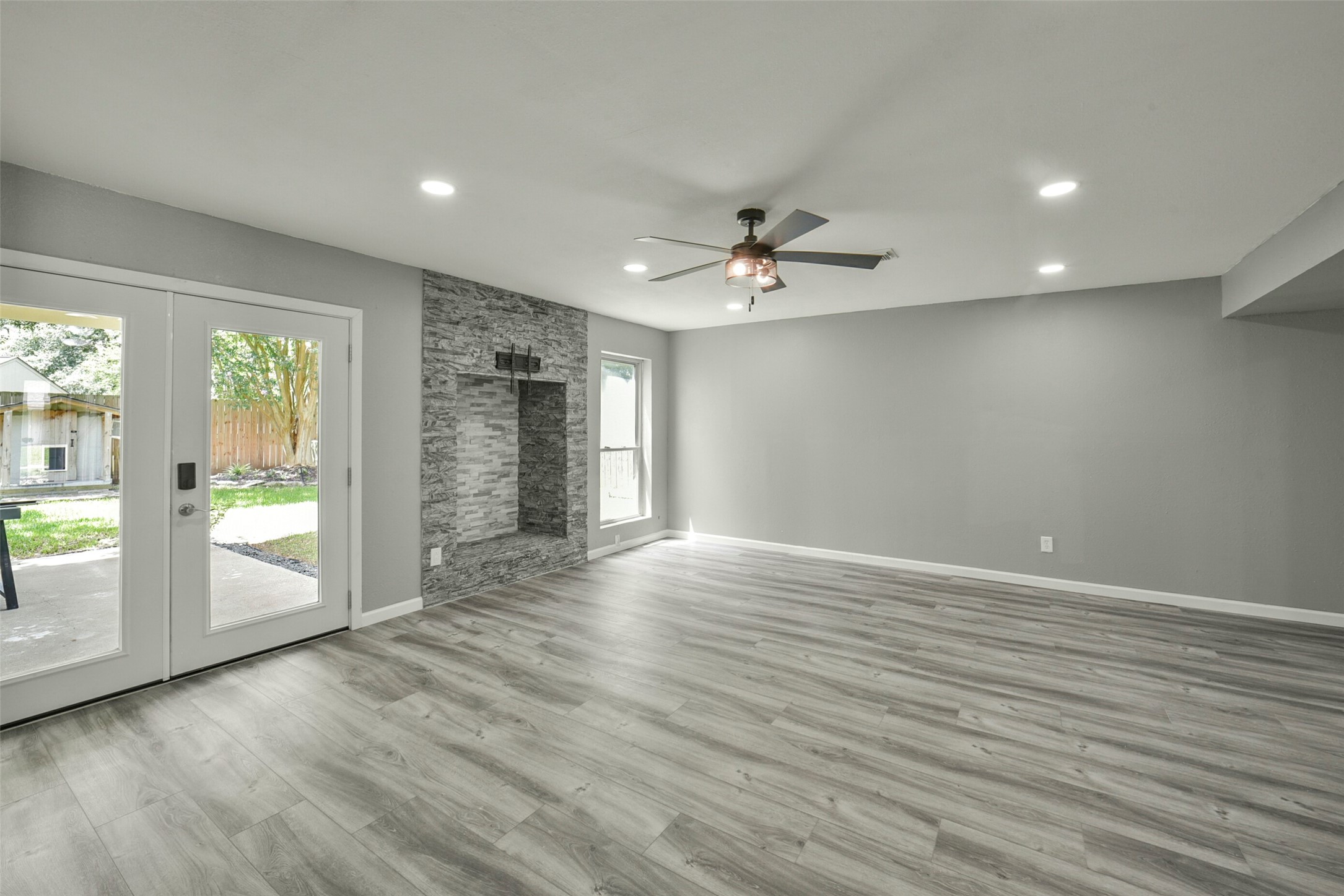 18606 Mellowgrove Lane Spring, TX 77379 - Photo 6 of 43 Recent French doors leading to the covered patio (Fireplace was sealed off at the top)