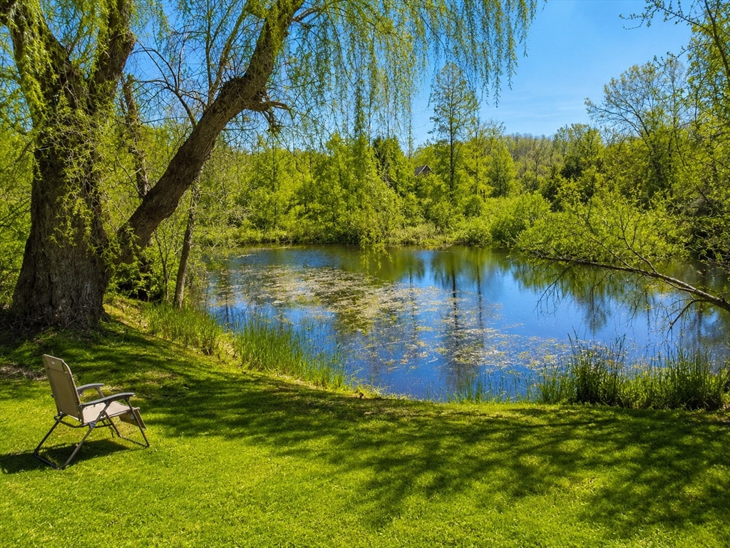 936 Stony Hill Road Wilbraham, MA 01095 - Photo 11 of 11 a view of a lake in a backyard