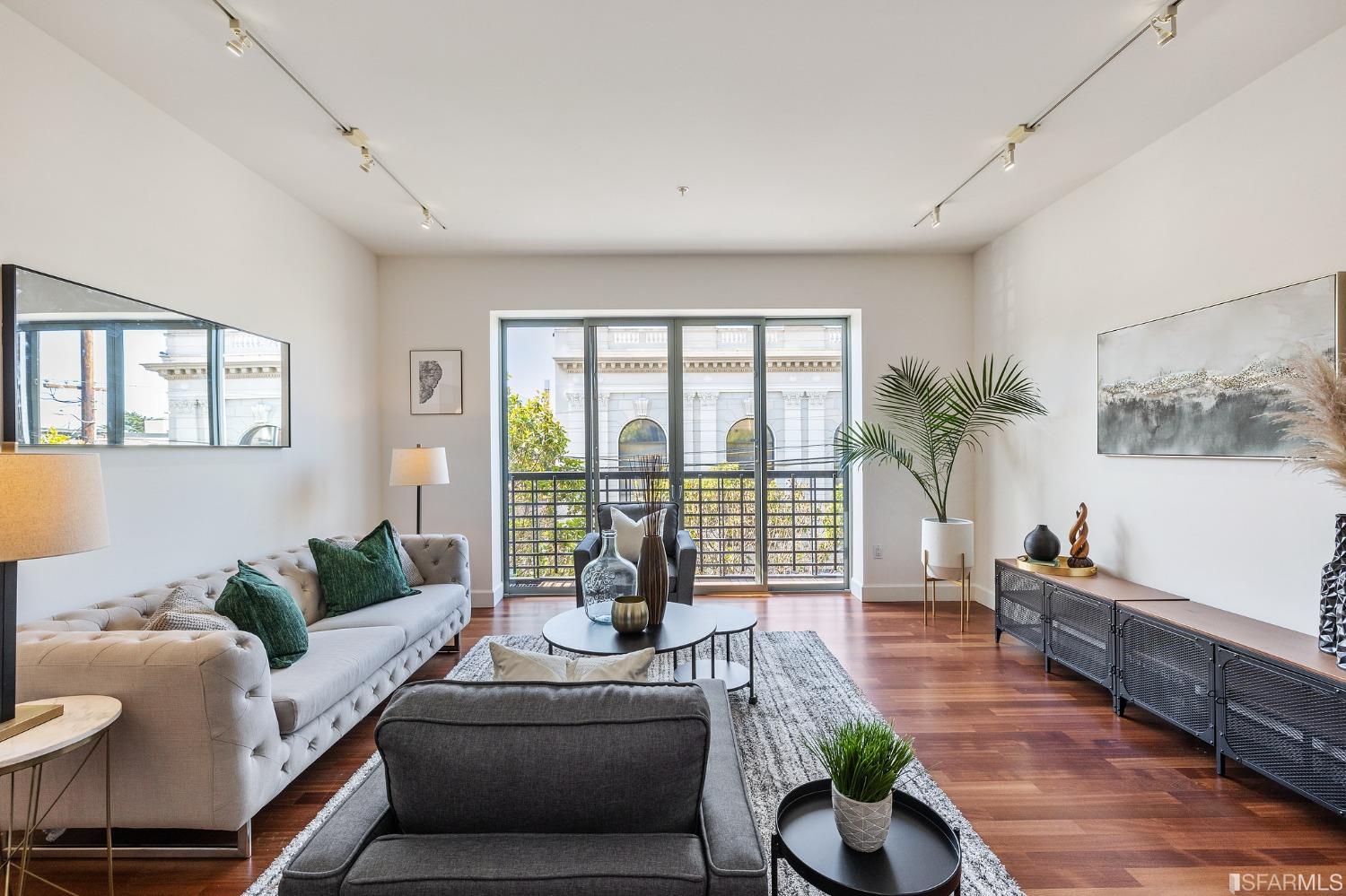 741 Clement Street, Unit 202 San Francisco, CA 94118 - Photo 1 of 23 a living room with furniture and a large window