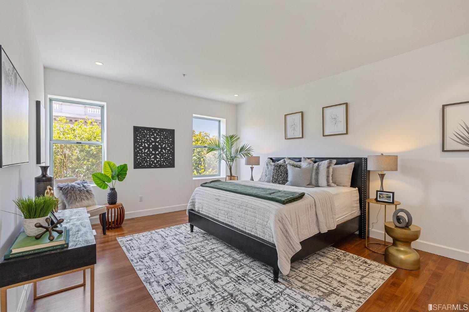 741 Clement Street, Unit 202 San Francisco, CA 94118 - Photo 12 of 23 a bedroom with a bed and wooden floor