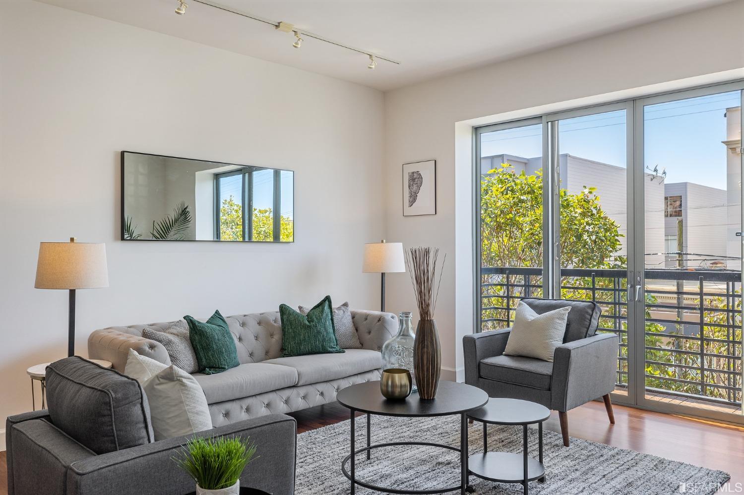 741 Clement Street, Unit 202 San Francisco, CA 94118 - Photo 5 of 23 a living room with furniture and a large window