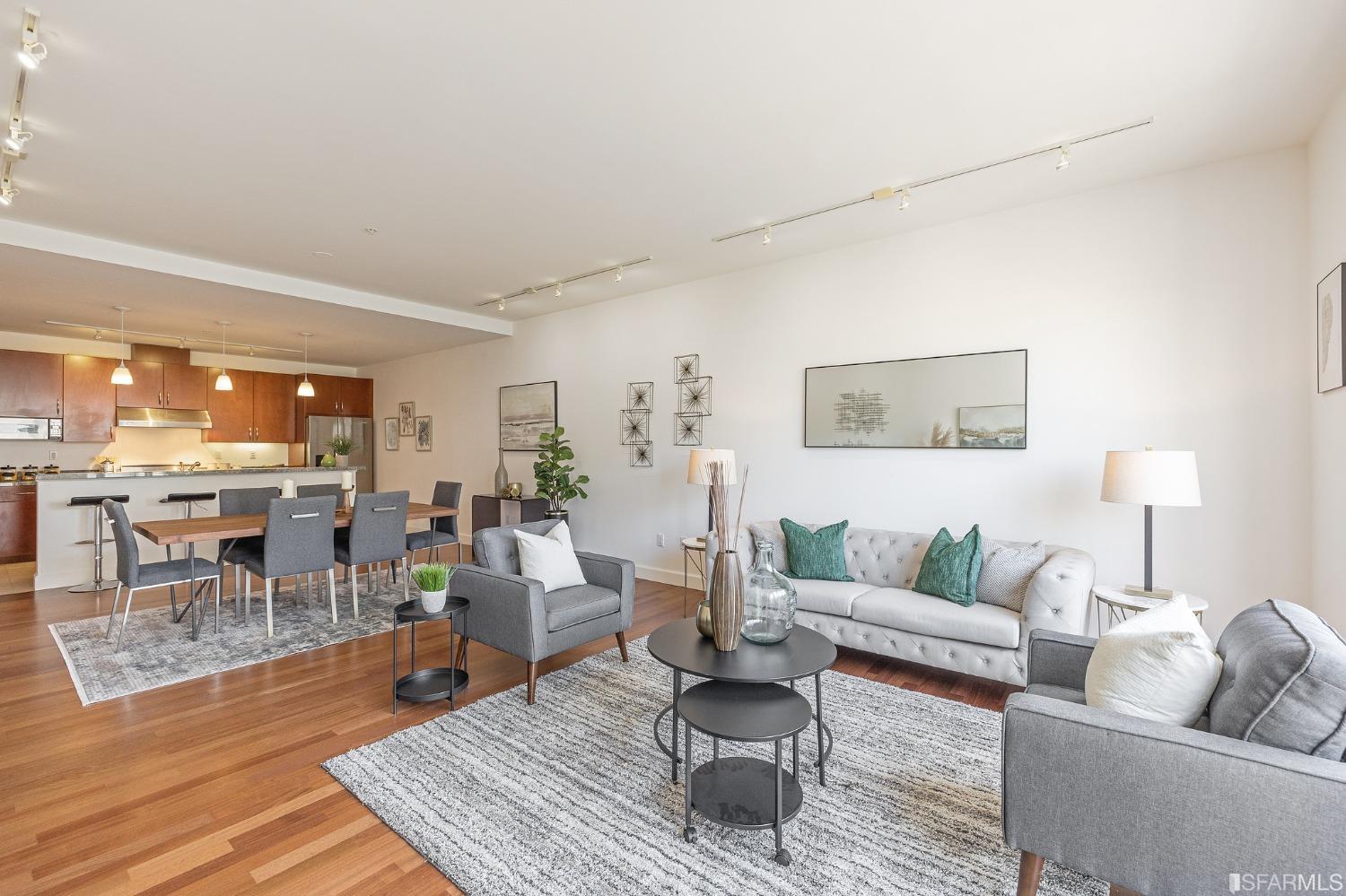 741 Clement Street, Unit 202 San Francisco, CA 94118 - Photo 7 of 23 a living room with furniture and wooden floor