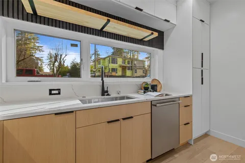 a kitchen with a sink and cabinets
