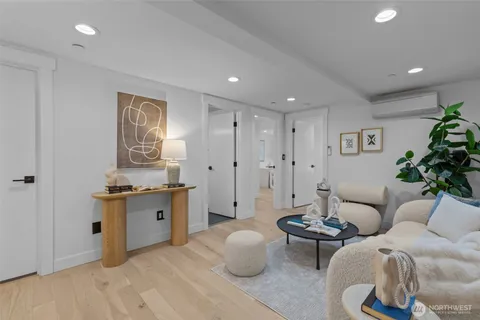 a living room with furniture and white walls