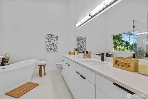 a bathroom with a tub and a shower