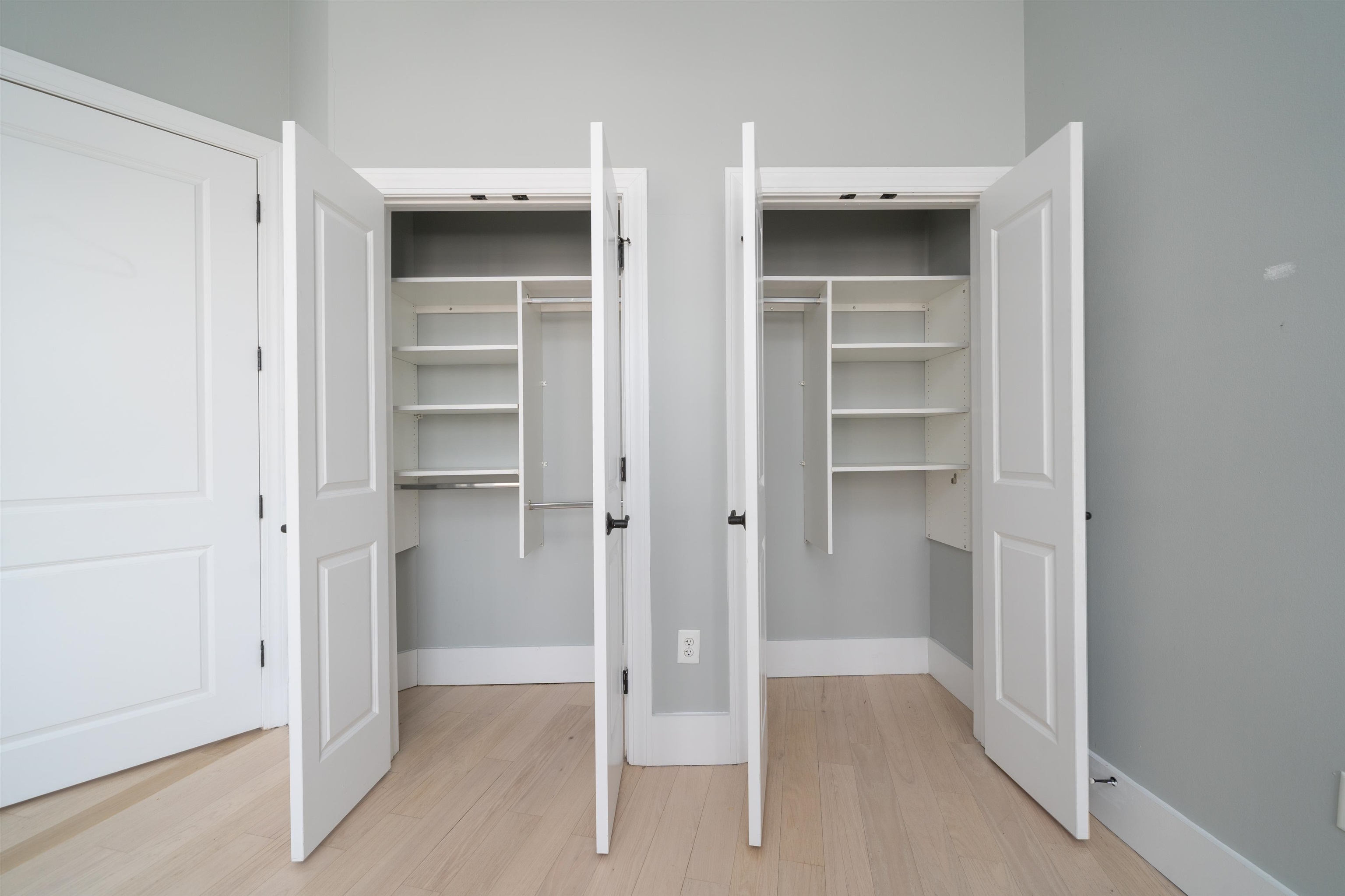 100 Paterson Plank Road, Unit 504 Jersey City, NJ 07307 - Photo 14 of 23 a view of a hallway with wooden shelves