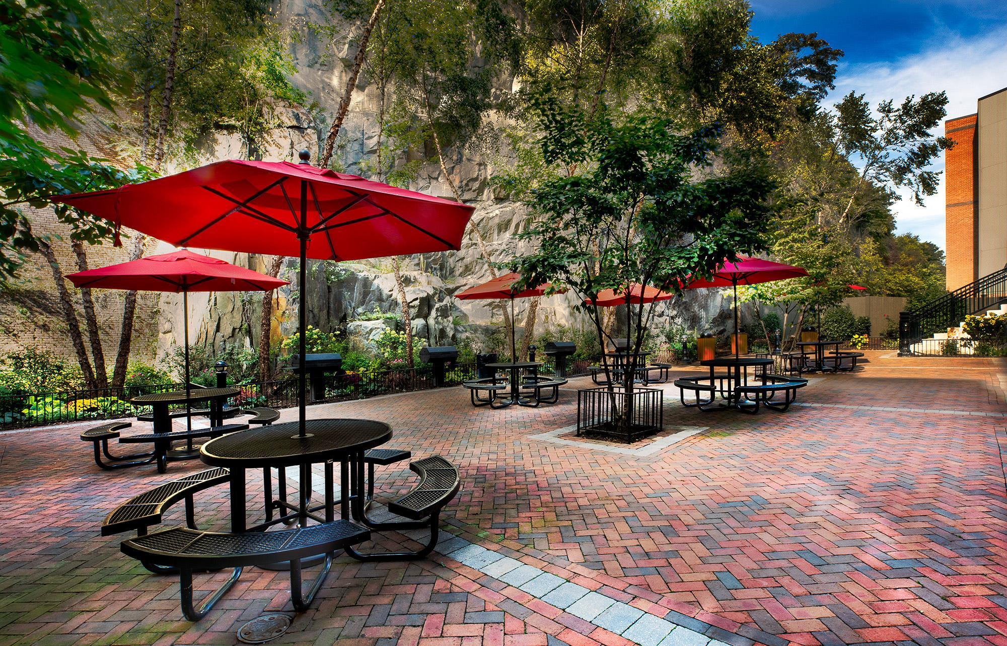 100 Paterson Plank Road, Unit 504 Jersey City, NJ 07307 - Photo 19 of 23 a view of a patio with furniture and table under an umbrella