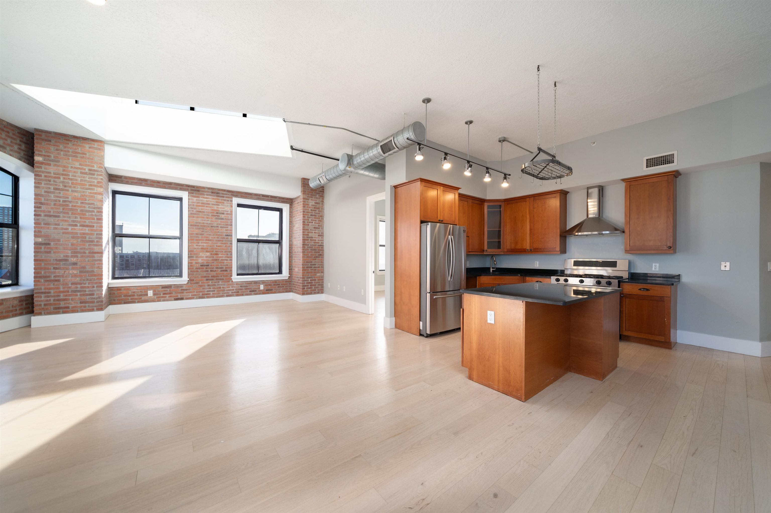 100 Paterson Plank Road, Unit 504 Jersey City, NJ 07307 - Photo 7 of 23 a view of kitchen with sink refrigerator and cabinets