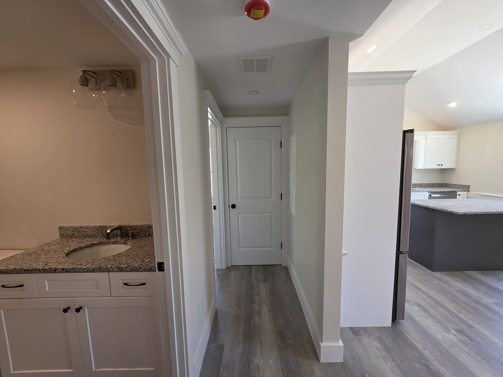 87 Acapesket Road, Unit 2A Falmouth, MA 02536 - Photo 11 of 17 a view of a kitchen from the hallway