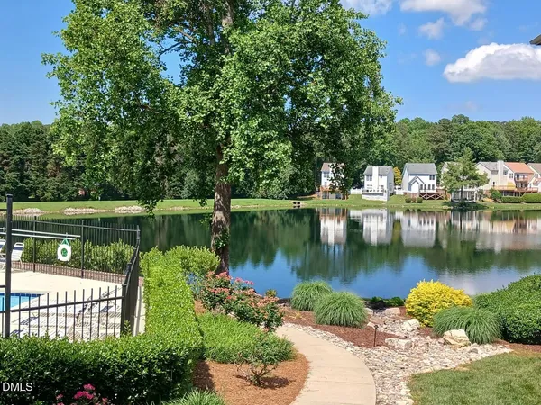 a view of a lake with a house in the background