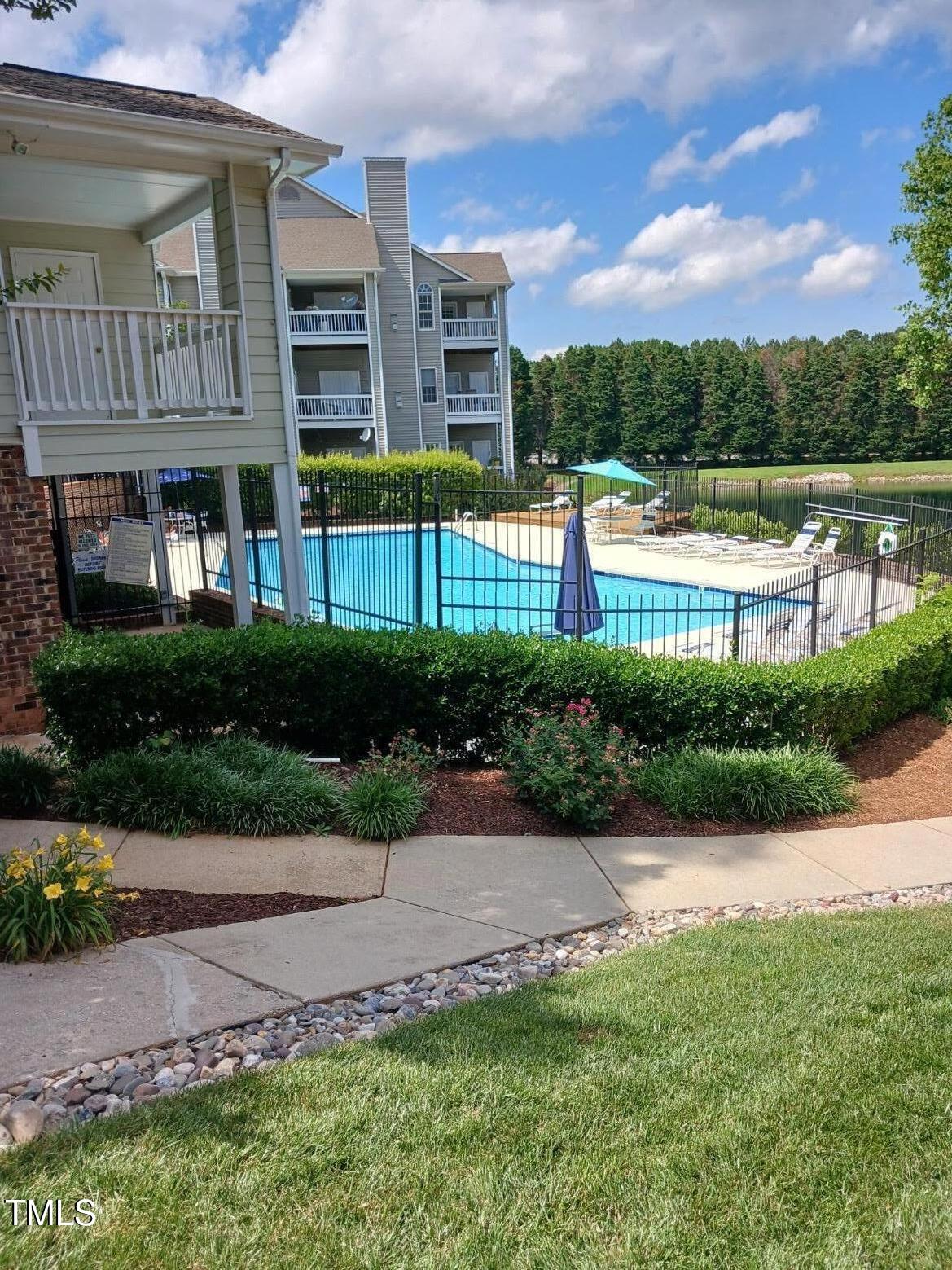631 Springfork Drive Cary, NC 27513 - Photo 2 of 23 a view of a house with a yard and a garden