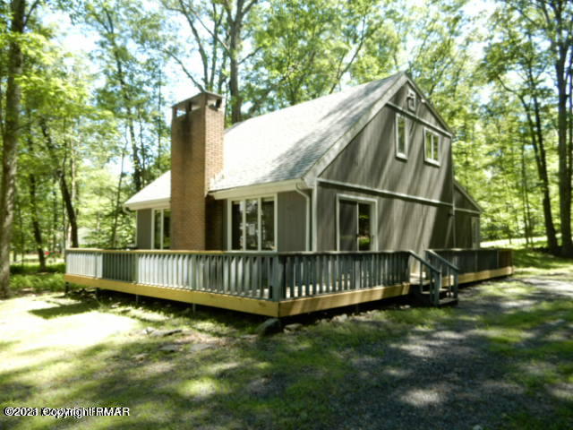 a view of backyard with deck and deck