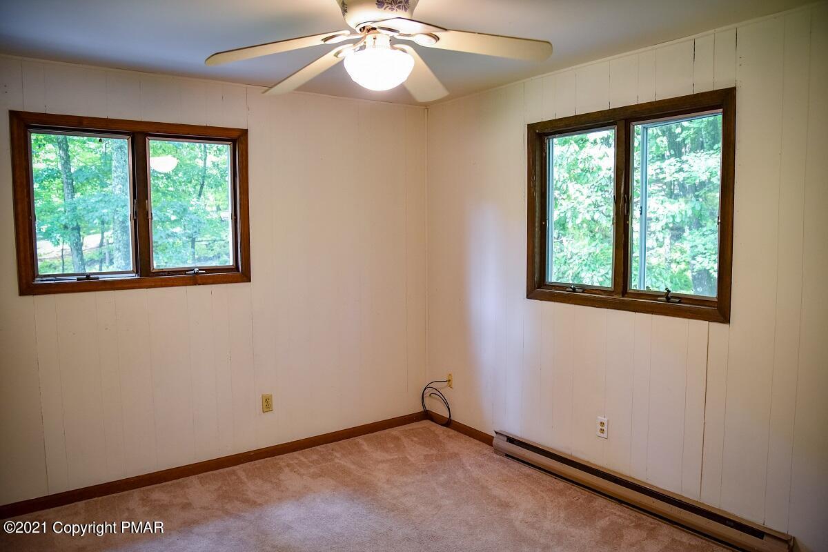 2202 Delaware Court East Bushkill, PA 18324 - Photo 13 of 18 an empty room with a window and a fan