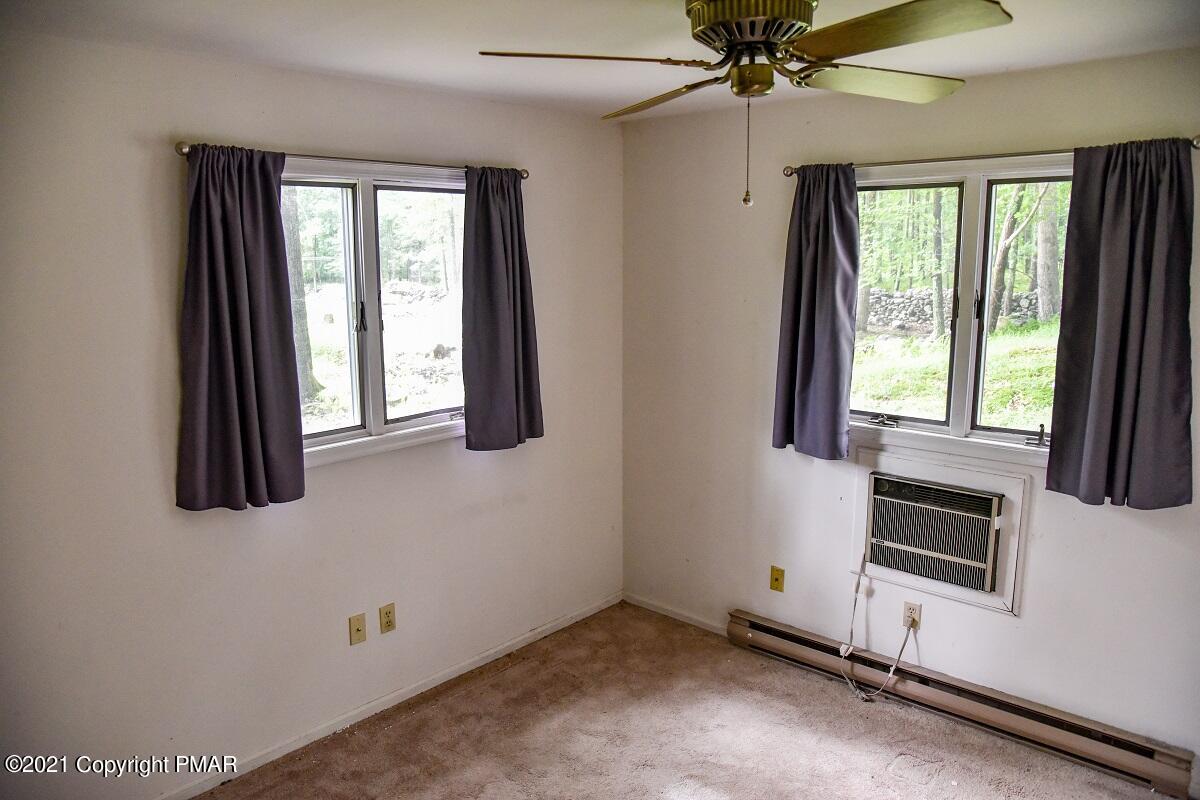 2202 Delaware Court East Bushkill, PA 18324 - Photo 16 of 18 wooden floor and window in an empty room