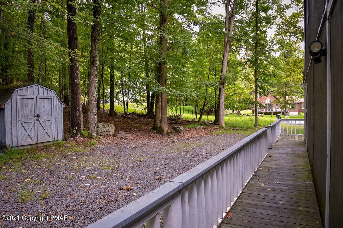 2202 Delaware Court East Bushkill, PA 18324 - Photo 17 of 18 a view of a park with large trees and a barn