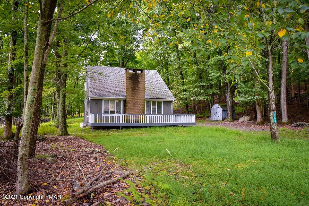 2202 Delaware Court East Bushkill, PA 18324 - Photo 3 of 18 a view of a house with a big yard plants and large trees