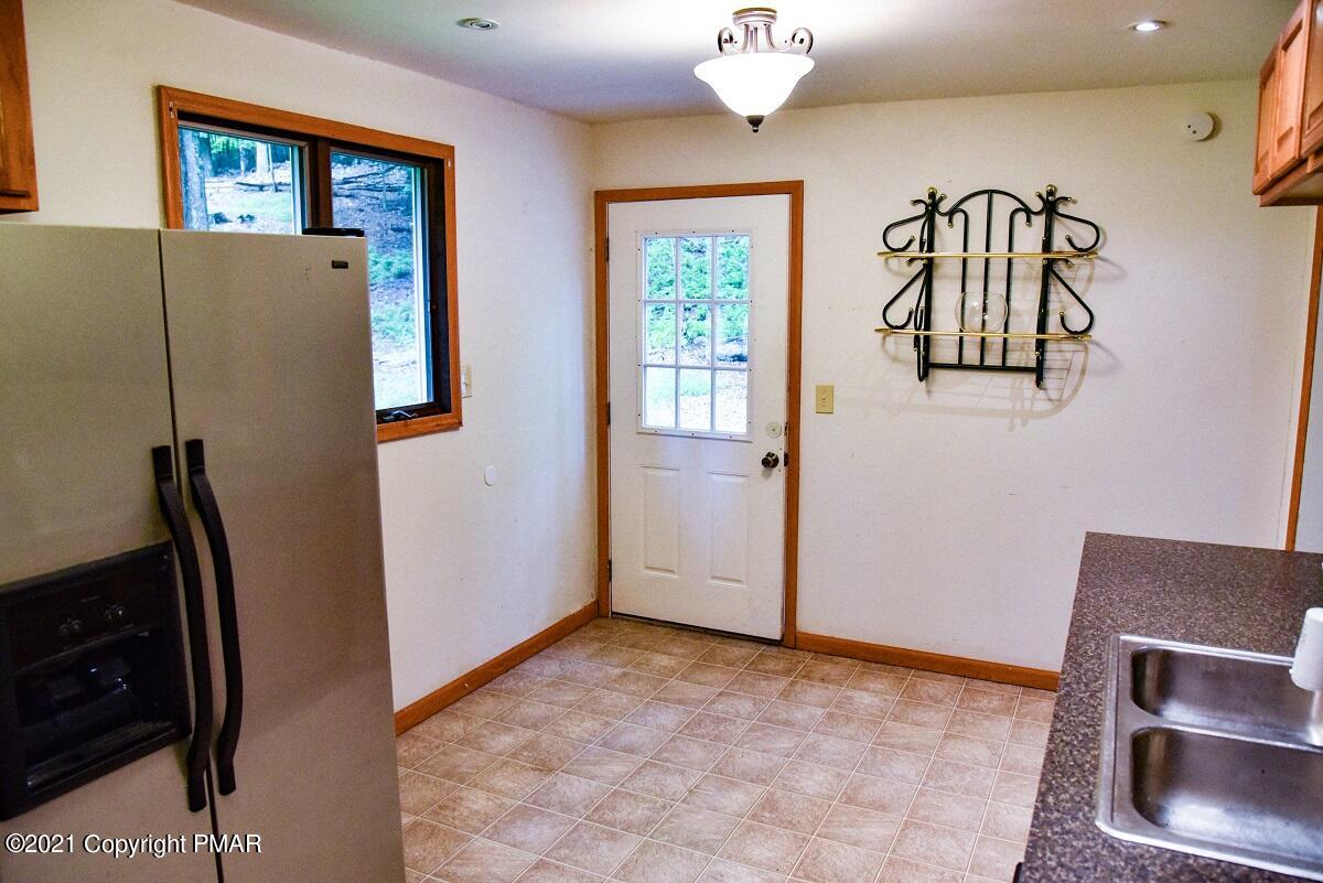 2202 Delaware Court East Bushkill, PA 18324 - Photo 6 of 18 a view of a hallway with entryway to windows