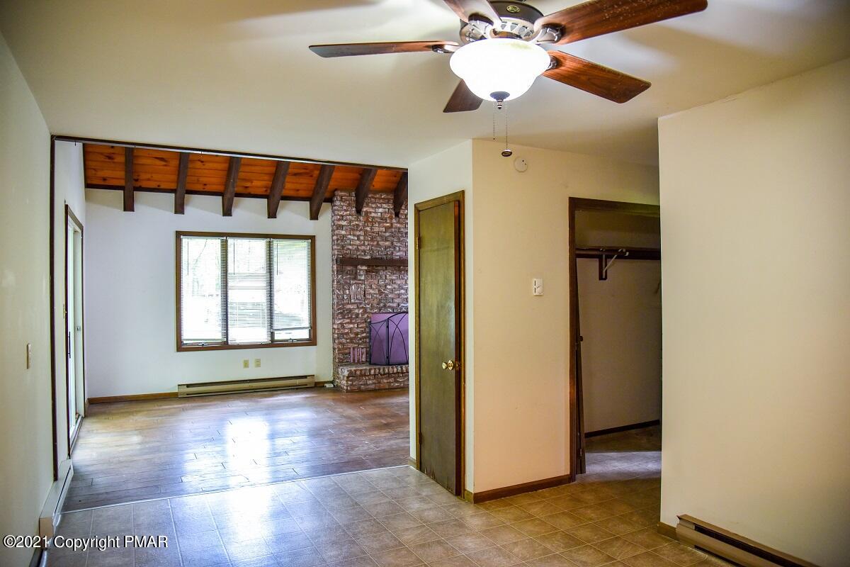 2202 Delaware Court East Bushkill, PA 18324 - Photo 7 of 18 a view of livingroom with window and a ceiling fan