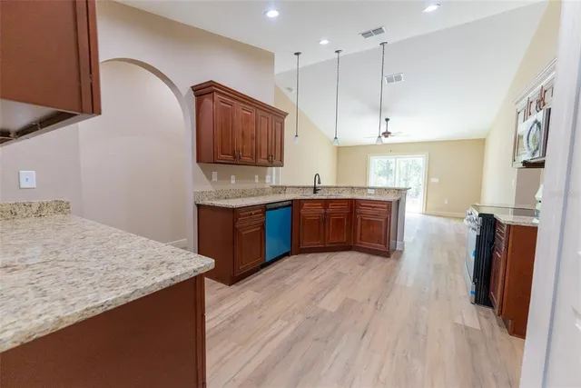 a view of a kitchen with a sink and cabinet area