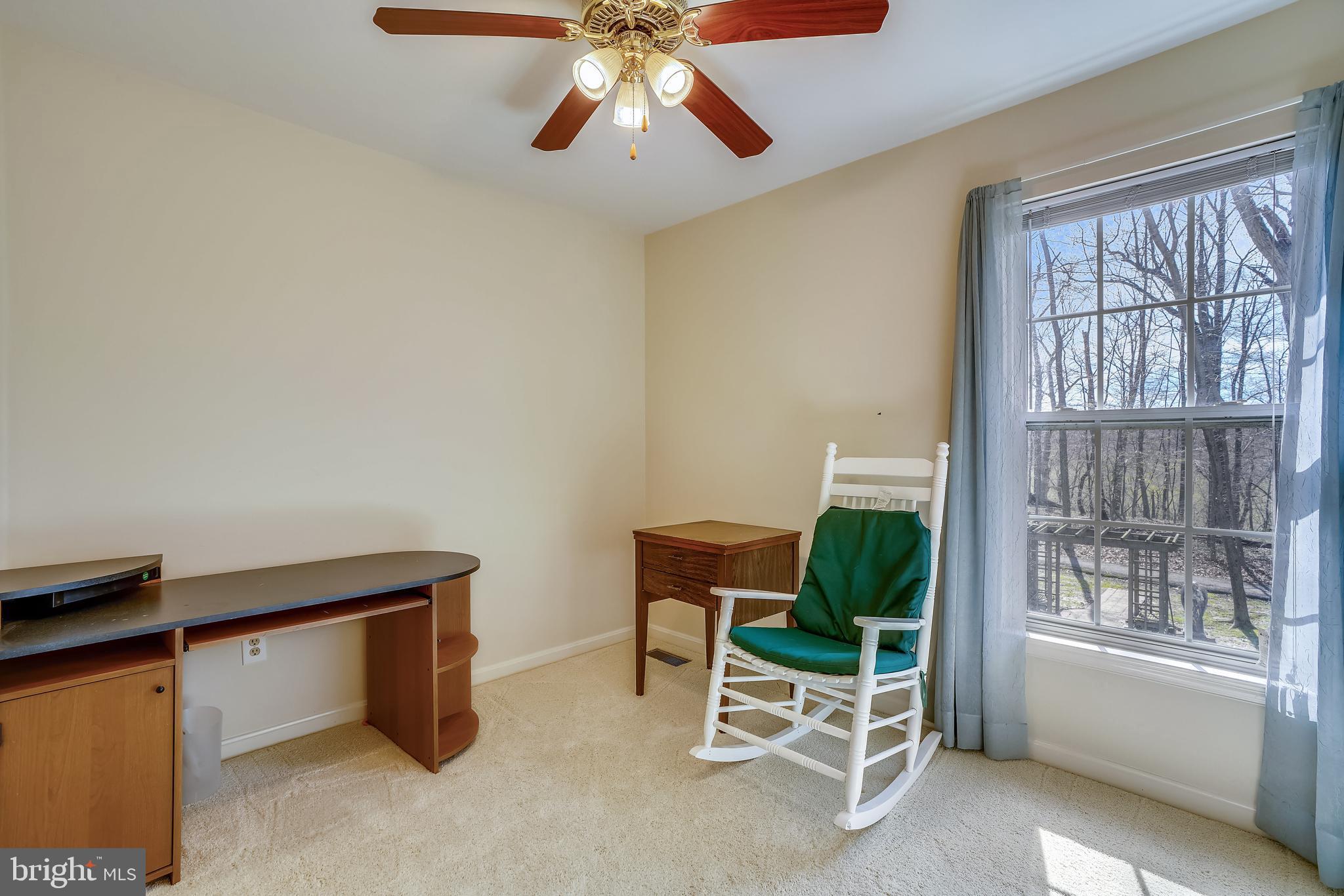8004 Big Pool Road Laurel, MD 20724 - Photo 23 of 39 a living room with furniture and a window