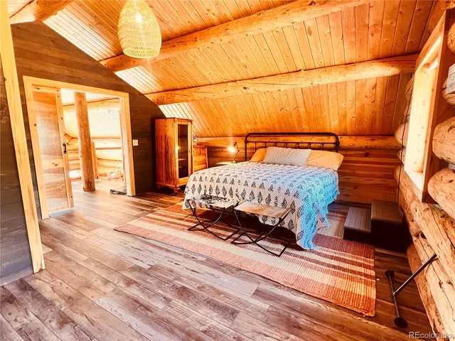 a room with a bed and a large window