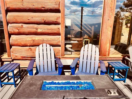 a view of living room with furniture and floor to ceiling window