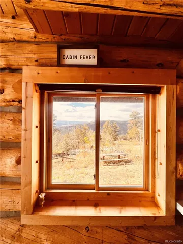 a view of a kitchen with a sink and a window