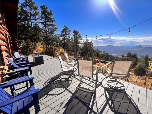 a view of a balcony with chairs