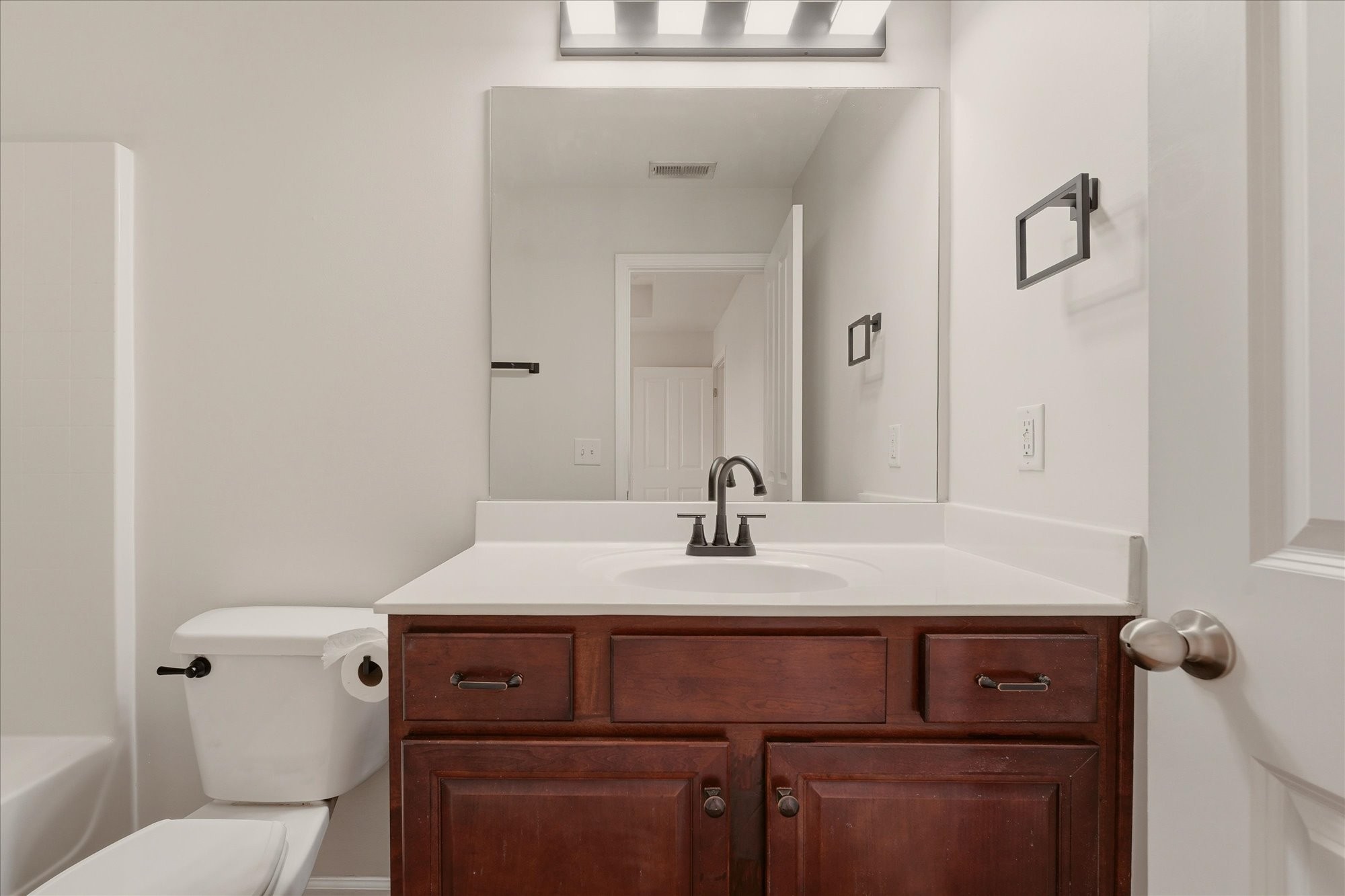 2050 Hemlock Drive Spring Hill, TN 37174 - Photo 19 of 48 a bathroom with a sink a toilet and mirror