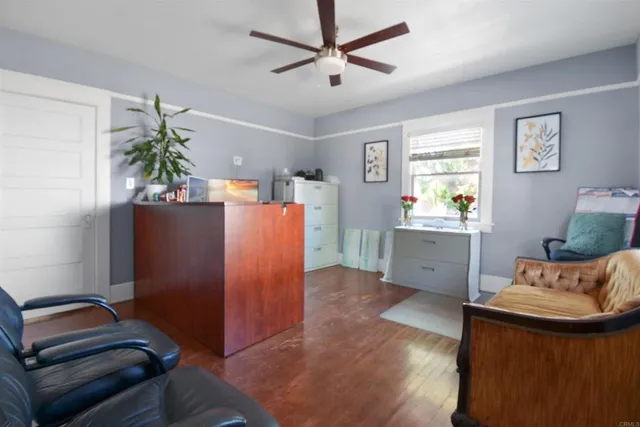 a view of kitchen with furniture and wooden floor