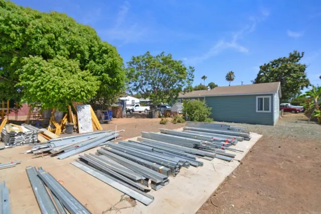 a view of a backyard with a sitting area