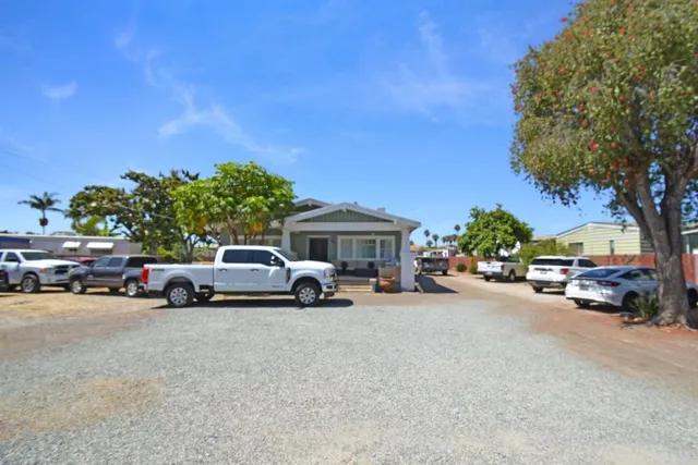 a view of a cars parked in front of a house