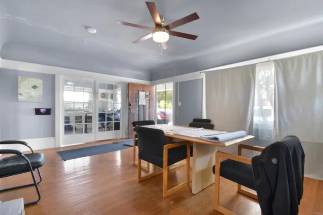 a view of a dining room with furniture window and wooden floor