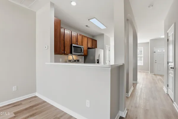 a view of a kitchen from the hallway