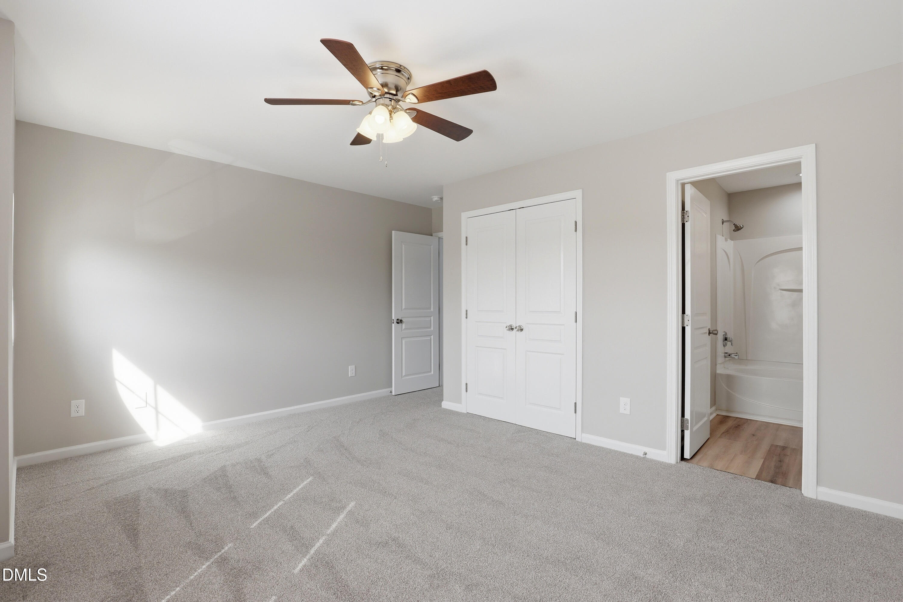 715 Bryant Street Raleigh, NC 27603 - Photo 19 of 25 a view of a big room with closet and a chandelier fan