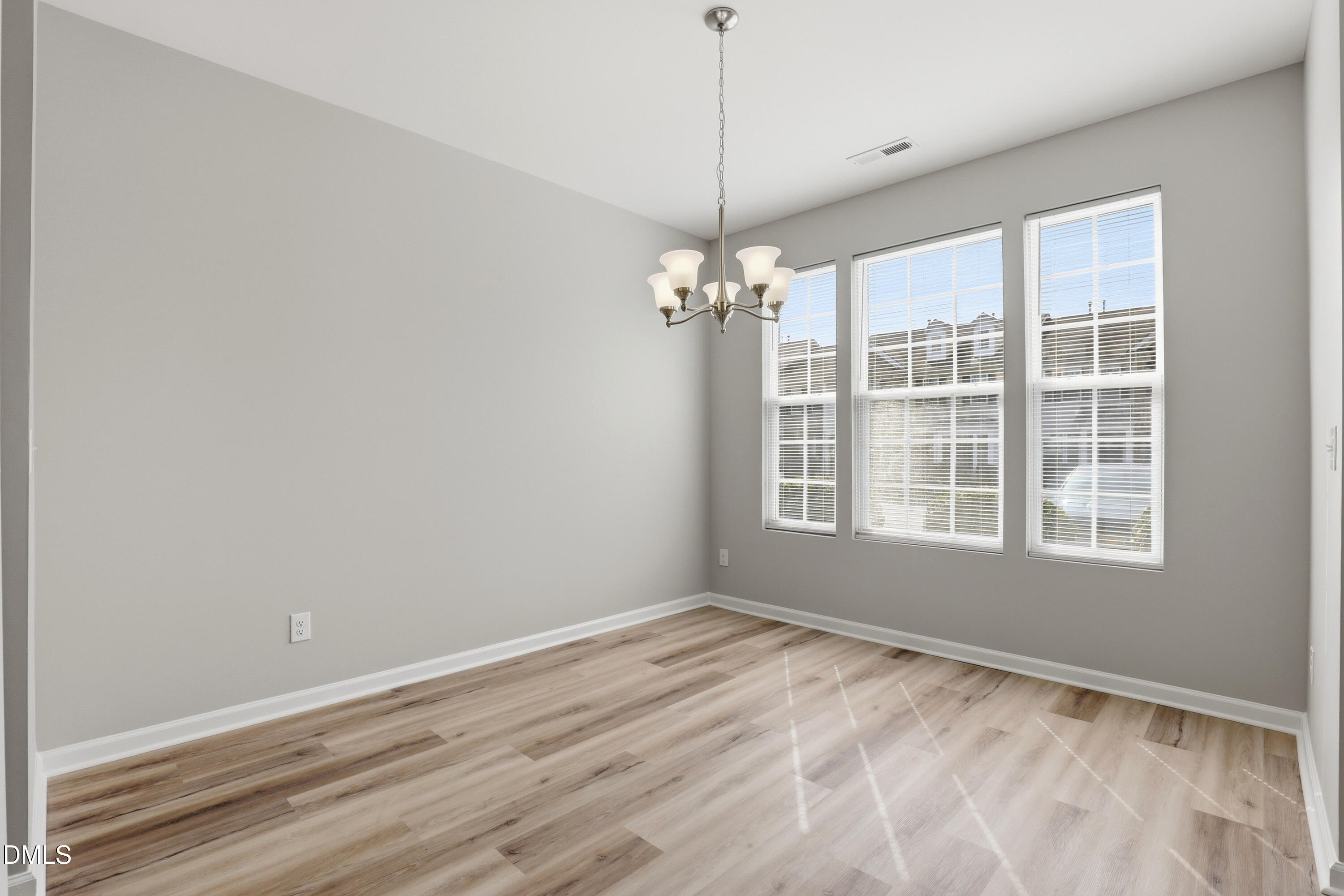 715 Bryant Street Raleigh, NC 27603 - Photo 5 of 25 a view of an empty room with a window