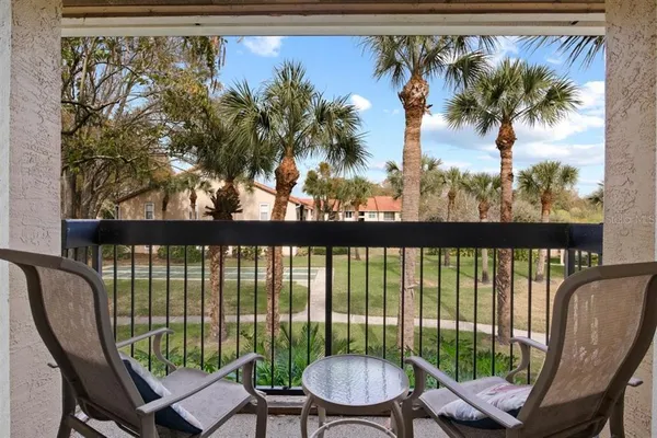 a view of a chairs and table in a patio