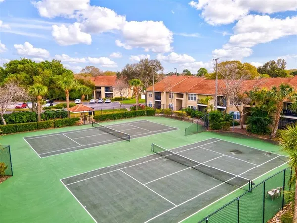 a view of an outdoor space and tennis court