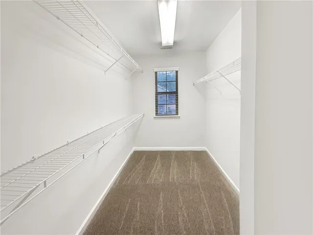 a view of an empty room with stairs