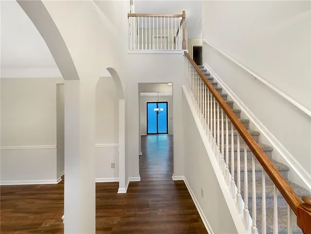 a view of staircase with wooden floor and staircase