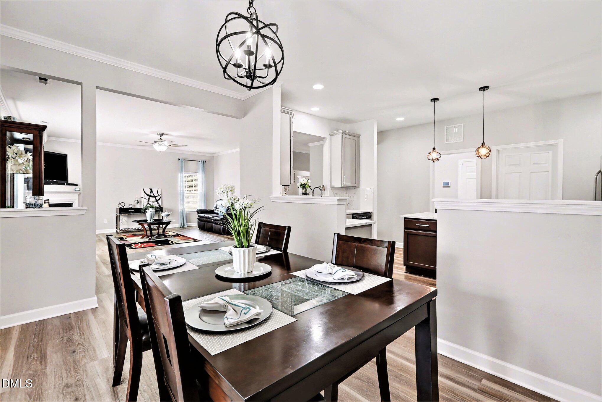 437 Field Glow Lane Apex, NC 27539 - Photo 16 of 48 a view of a dining room with furniture